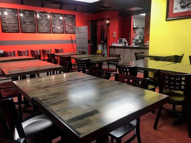 slate walnut table tops with perforated metal chair with walnut seat at Uni Curry Bowl